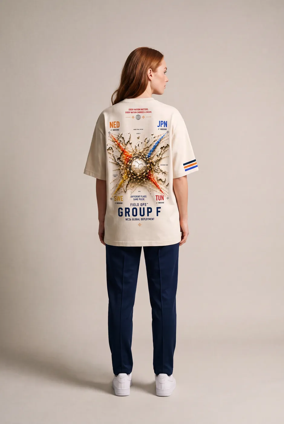 Group F tee worn on model, studio back.